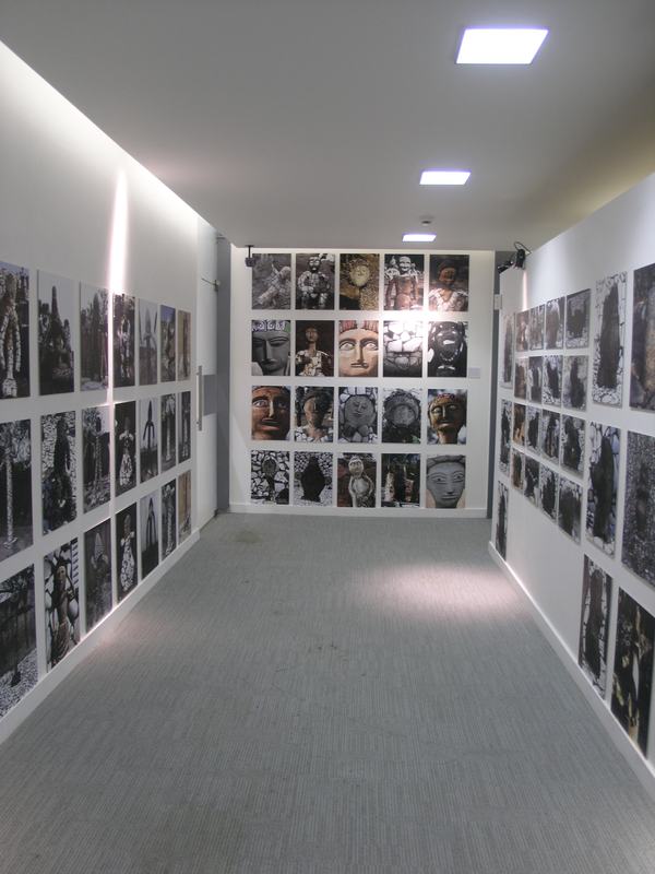 The catalogue corridor, lined with photographs of the garden’s figures and rocks