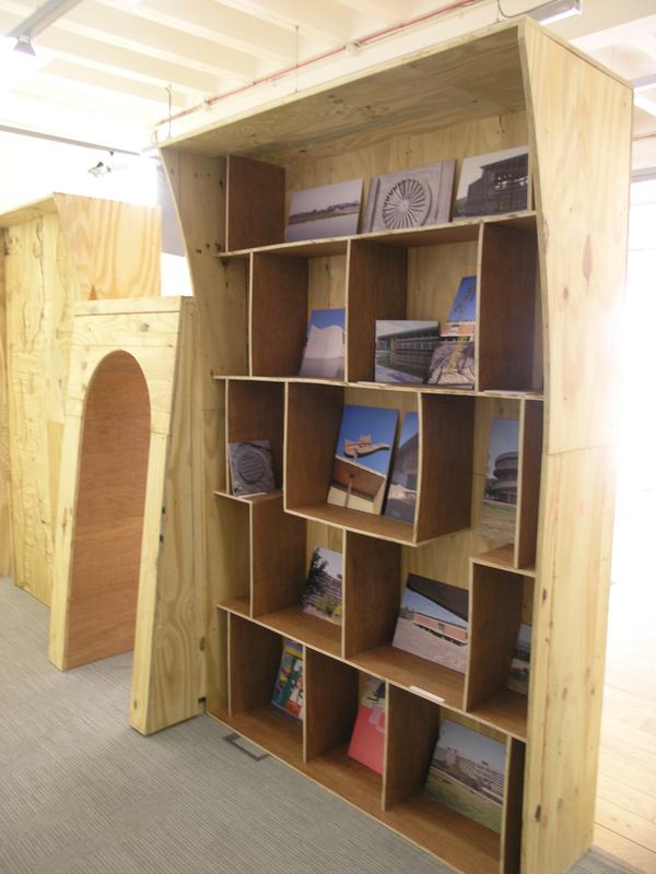 The timber display structure, with shelves of photographs