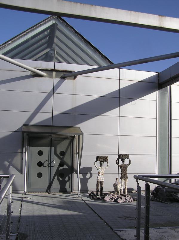 Two figures on the terrace at the Liverpool School of Architecture, before installation at the gallery