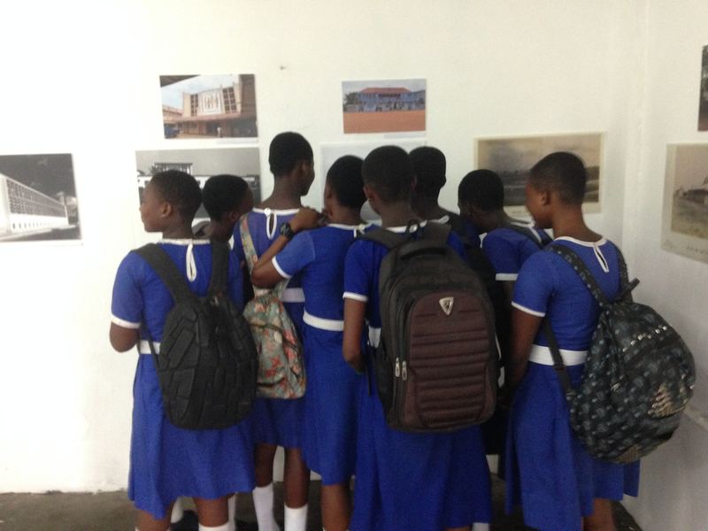 Students looking at the photographs